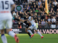 Jay Idzes of Venezia plays against Lazar Samardzic of Atalanta during the Italian Serie A soccer match between Venezia FC and Atalanta BC at...