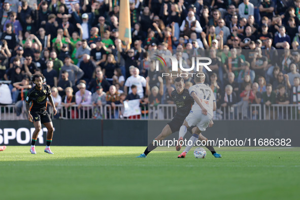 Atalanta's Charles De Ketelaere plays against Venezia's Jay Idzes during the Italian Serie A soccer championship football match between Vene...