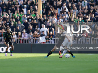 Atalanta's Charles De Ketelaere plays against Venezia's Jay Idzes during the Italian Serie A soccer championship football match between Vene...