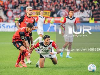 Omar Marmoush of Eintracht Frankfurt plays against Piero Hincapie of Bayer 04 Leverkusen during the Bundesliga match between Bayer 04 Leverk...