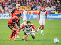 Omar Marmoush of Eintracht Frankfurt plays against Piero Hincapie of Bayer 04 Leverkusen during the Bundesliga match between Bayer 04 Leverk...