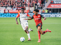 Amine Adli of Bayer 04 Leverkusen plays against Junior Dina Ebimbe of Eintracht Frankfurt during the Bundesliga match between Bayer 04 Lever...