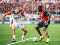 Victor Boniface of Bayer 04 Leverkusen plays against Rasmus Kristensen of Eintracht Frankfurt during the Bundesliga match between Bayer 04 L...