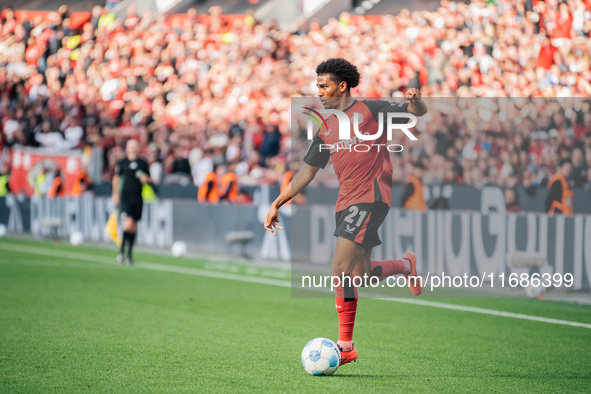 Amine Adli of Bayer 04 Leverkusen plays the ball during the Bundesliga match between Bayer 04 Leverkusen and Eintracht Frankfurt at BayArena...