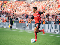 Amine Adli of Bayer 04 Leverkusen plays the ball during the Bundesliga match between Bayer 04 Leverkusen and Eintracht Frankfurt at BayArena...