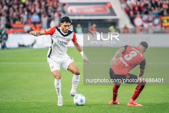 Omar Marmoush of Eintracht Frankfurt plays against Piero Hincapie of Bayer 04 Leverkusen during the Bundesliga match between Bayer 04 Leverk...