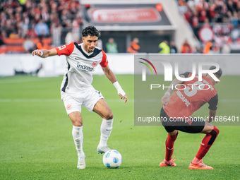 Omar Marmoush of Eintracht Frankfurt plays against Piero Hincapie of Bayer 04 Leverkusen during the Bundesliga match between Bayer 04 Leverk...