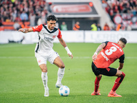 Omar Marmoush of Eintracht Frankfurt plays against Piero Hincapie of Bayer 04 Leverkusen during the Bundesliga match between Bayer 04 Leverk...