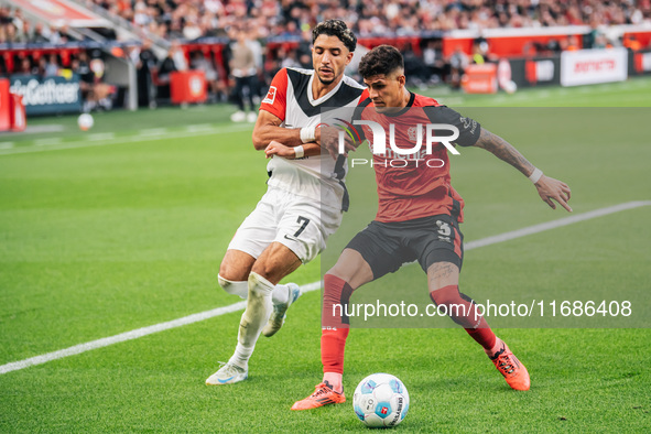 Omar Marmoush of Eintracht Frankfurt plays against Piero Hincapie of Bayer 04 Leverkusen during the Bundesliga match between Bayer 04 Leverk...