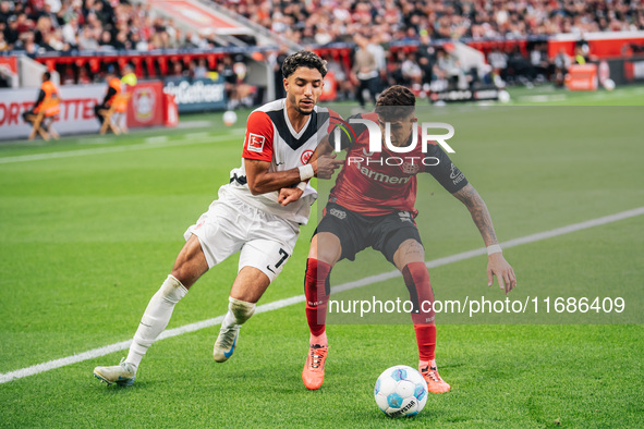 Omar Marmoush of Eintracht Frankfurt plays against Piero Hincapie of Bayer 04 Leverkusen during the Bundesliga match between Bayer 04 Leverk...