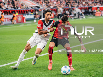 Omar Marmoush of Eintracht Frankfurt plays against Piero Hincapie of Bayer 04 Leverkusen during the Bundesliga match between Bayer 04 Leverk...