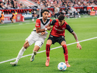 Omar Marmoush of Eintracht Frankfurt plays against Piero Hincapie of Bayer 04 Leverkusen during the Bundesliga match between Bayer 04 Leverk...