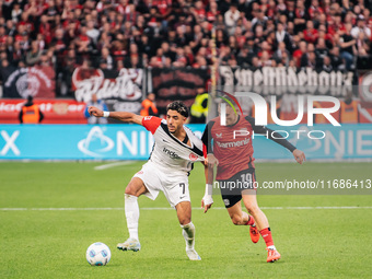 Omar Marmoush of Eintracht Frankfurt plays against Florian Wirtz of Bayer 04 Leverkusen during the Bundesliga match between Bayer 04 Leverku...