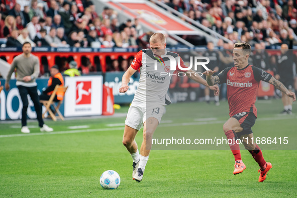 Rasmus Kristensen of Eintracht Frankfurt plays against Alejandro Grimaldo of Bayer 04 Leverkusen during the Bundesliga match between Bayer 0...