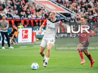 Rasmus Kristensen of Eintracht Frankfurt plays against Alejandro Grimaldo of Bayer 04 Leverkusen during the Bundesliga match between Bayer 0...