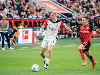 Rasmus Kristensen of Eintracht Frankfurt plays against Alejandro Grimaldo of Bayer 04 Leverkusen during the Bundesliga match between Bayer 0...