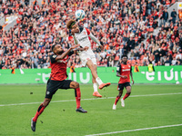 Hugo Ekitike of Eintracht Frankfurt plays against Jonathan Tah of Bayer 04 Leverkusen during the Bundesliga match between Bayer 04 Leverkuse...