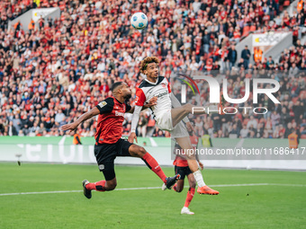 Hugo Ekitike of Eintracht Frankfurt plays against Jonathan Tah of Bayer 04 Leverkusen during the Bundesliga match between Bayer 04 Leverkuse...