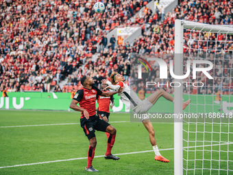 Hugo Ekitike of Eintracht Frankfurt plays against Jonathan Tah of Bayer 04 Leverkusen during the Bundesliga match between Bayer 04 Leverkuse...