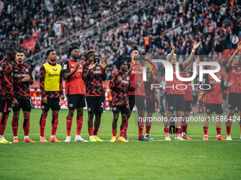 Players of Bayer 04 Leverkusen celebrate with fans after the Bundesliga match between Bayer 04 Leverkusen and Eintracht Frankfurt at BayAren...