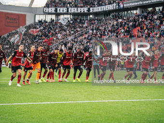 Players of Bayer 04 Leverkusen celebrate with fans after the Bundesliga match between Bayer 04 Leverkusen and Eintracht Frankfurt at BayAren...