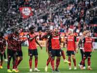 Players of Bayer 04 Leverkusen celebrate with fans after the Bundesliga match between Bayer 04 Leverkusen and Eintracht Frankfurt at BayAren...