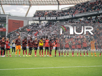 Players of Bayer 04 Leverkusen celebrate with fans after the Bundesliga match between Bayer 04 Leverkusen and Eintracht Frankfurt at BayAren...