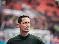 Dino Toppmoeller, Head Coach of Eintracht Frankfurt, looks on prior to the Bundesliga match between Bayer 04 Leverkusen and Eintracht Frankf...