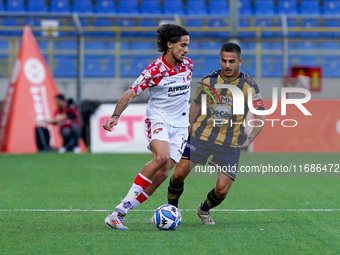 Leonardo Sernicola of Cremonese competes for the ball with Davide Buglio of SS Juve Stabia during the Serie B match between SS Juve Stabia a...