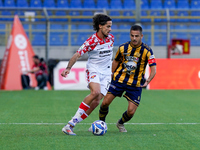 Leonardo Sernicola of Cremonese competes for the ball with Davide Buglio of SS Juve Stabia during the Serie B match between SS Juve Stabia a...