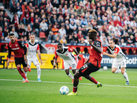 Victor Boniface of Bayer 04 Leverkusen takes a penalty during the Bundesliga match between Bayer 04 Leverkusen and Eintracht Frankfurt at Ba...