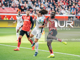 Victor Boniface of Bayer 04 Leverkusen plays against Arthur Theate of Eintracht Frankfurt during the Bundesliga match between Bayer 04 Lever...