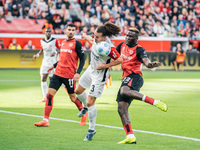 Victor Boniface of Bayer 04 Leverkusen plays against Arthur Theate of Eintracht Frankfurt during the Bundesliga match between Bayer 04 Lever...