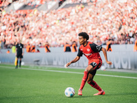 Amine Adli of Bayer 04 Leverkusen is in action during the Bundesliga match between Bayer 04 Leverkusen and Eintracht Frankfurt at BayArena i...