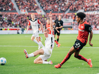 Amine Adli of Bayer 04 Leverkusen is in action during the Bundesliga match between Bayer 04 Leverkusen and Eintracht Frankfurt at BayArena i...