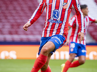 Antoine Griezmann of Atletico de Madrid is in action with the ball during the La Liga EA Sports 2024/25 football match between Atletico de M...