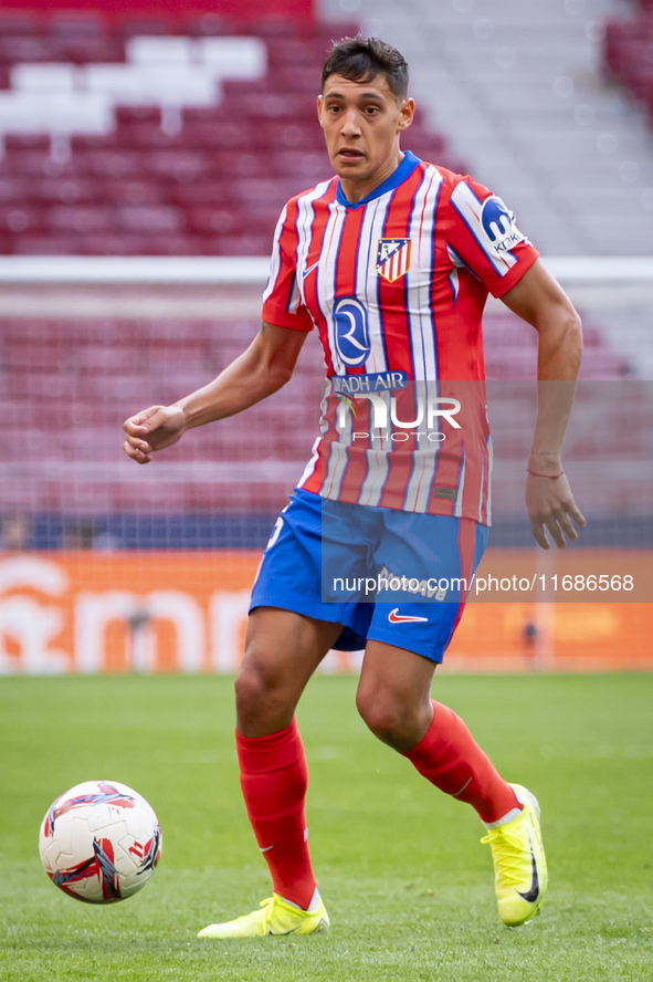 Nahuel Molina of Atletico de Madrid is in action with the ball during the La Liga EA Sports 2024/25 football match between Atletico de Madri...