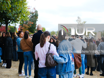 One Direction fans gather in Paris, France, to pay tribute to Liam Payne. (