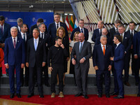 Ukraine's president Volodymyr Zelensky stands prior to the family photo. He is surrounded by EU leaders, discussing economy and competitiven...