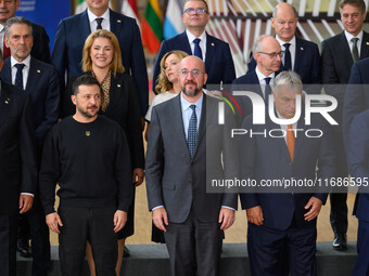 Ukraine's president Volodymyr Zelensky stands prior to the family photo. He is surrounded by EU leaders, discussing economy and competitiven...