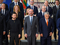 Ukraine's president Volodymyr Zelensky stands prior to the family photo. He is surrounded by EU leaders, discussing economy and competitiven...