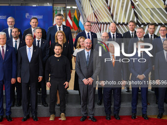 Ukraine's president Volodymyr Zelensky stands prior to the family photo. He is surrounded by EU leaders, discussing economy and competitiven...