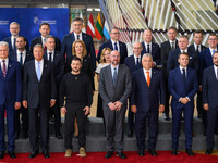 Ukraine's president Volodymyr Zelensky stands prior to the family photo. He is surrounded by EU leaders, discussing economy and competitiven...