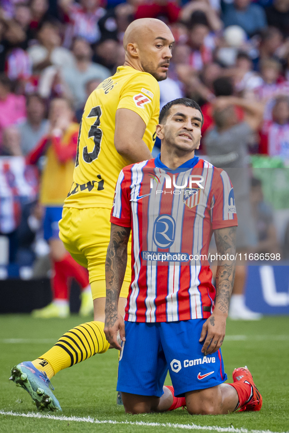 Angel Correa of Atletico de Madrid (R) is on the ground with Marko Dmitrovic of CD Leganes (L) beside him during the La Liga EA Sports 2024/...