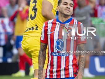 Angel Correa of Atletico de Madrid (R) is on the ground with Marko Dmitrovic of CD Leganes (L) beside him during the La Liga EA Sports 2024/...