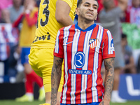 Angel Correa of Atletico de Madrid (R) is on the ground with Marko Dmitrovic of CD Leganes (L) beside him during the La Liga EA Sports 2024/...