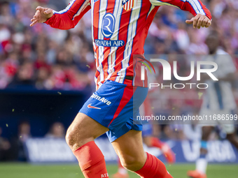 Antoine Griezmann of Atletico de Madrid is in action with the ball during the La Liga EA Sports 2024/25 football match between Atletico de M...