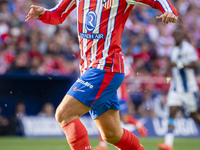 Antoine Griezmann of Atletico de Madrid is in action with the ball during the La Liga EA Sports 2024/25 football match between Atletico de M...