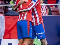 Antoine Griezmann of Atletico de Madrid (L) celebrates his goal by hugging Rodrigo De Paul of Atletico de Madrid (R) during the La Liga EA S...