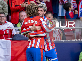 Antoine Griezmann of Atletico de Madrid (L) celebrates his goal by hugging Rodrigo De Paul of Atletico de Madrid (R) during the La Liga EA S...